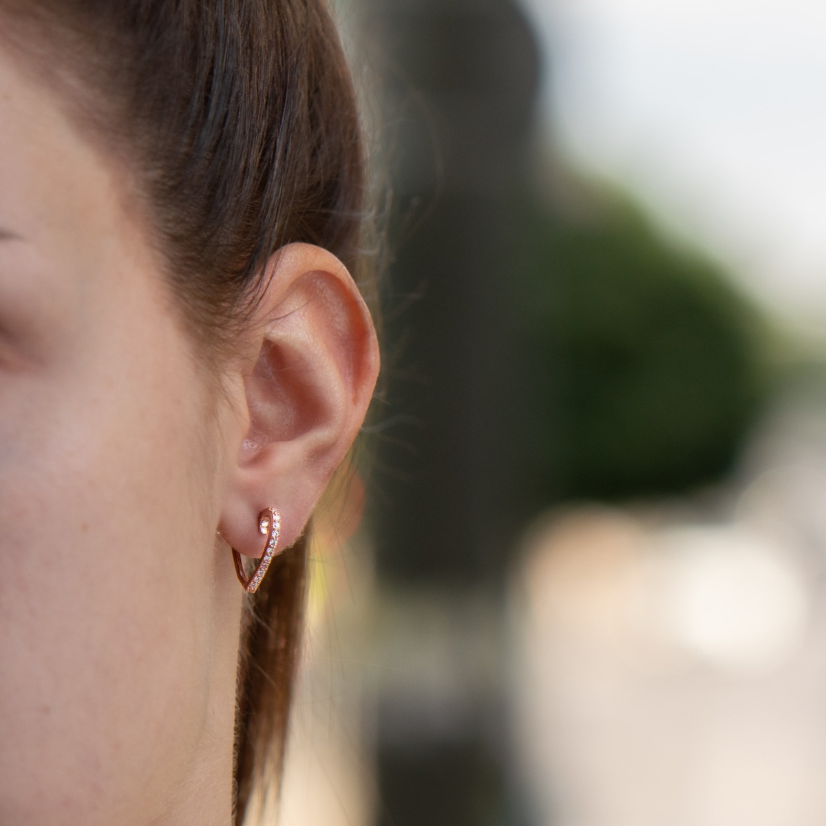 Extremely elegant women's heart-shaped earrings made entirely of rose silver and sparkling zircons. The clasp is an English type - secure and comfortable for ladies.