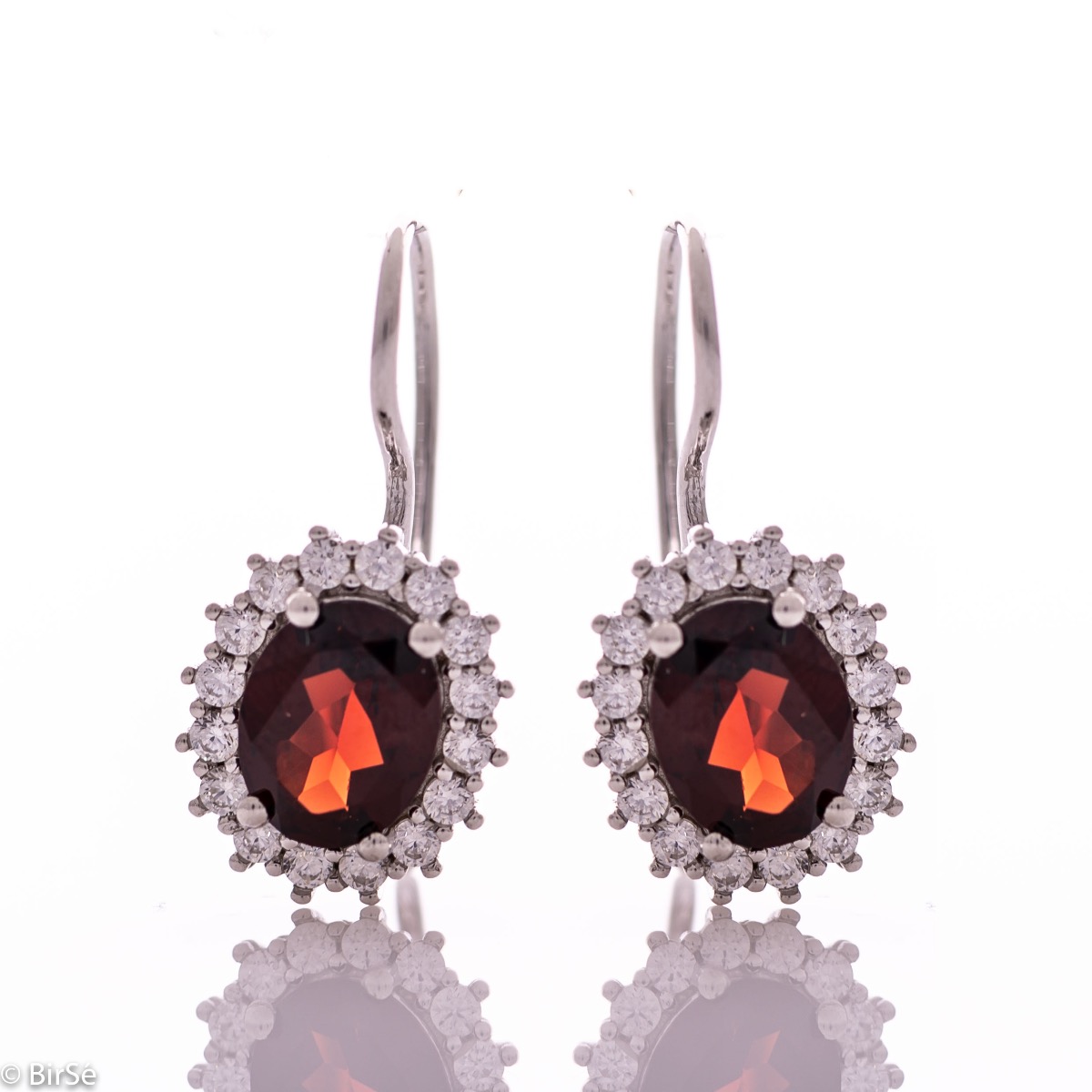 Exclusive women's earrings with exquisite workmanship combining delicate rhodium silver with radiant natural garnet surrounded by sparkling zircons.