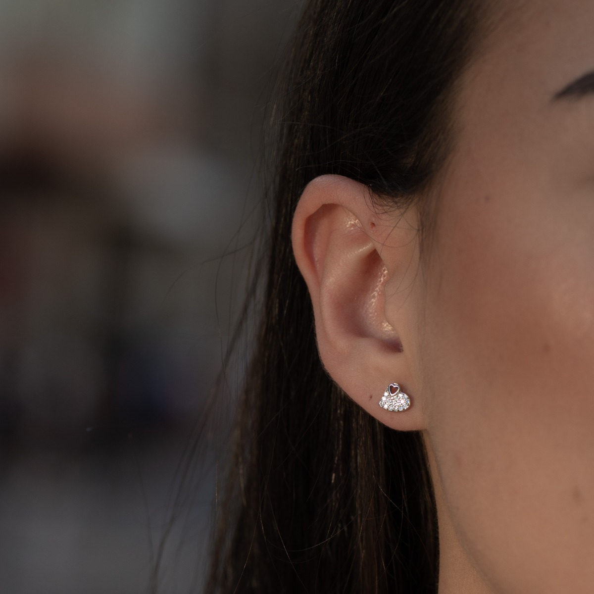 Elegant silver earrings in the shape of delicate hearts, beautifully fused into each other. Stylish workmanship of the composite compositional elements from a fine combination of rhodium-plated silver with sparkling zircon stones.