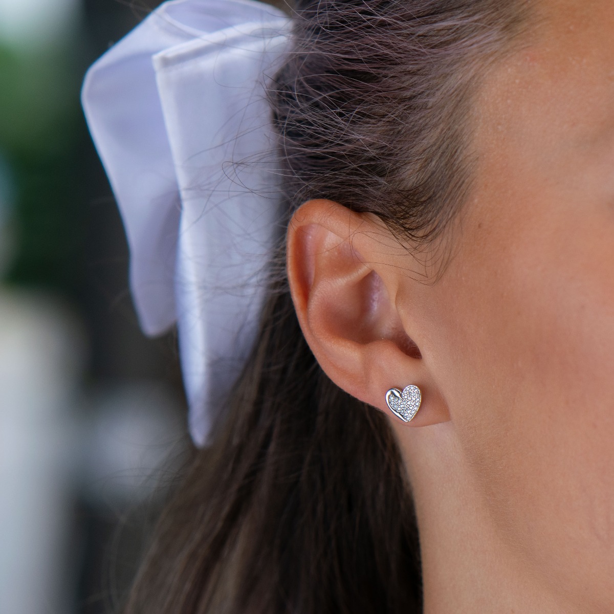 Swan Heart silver earrings - an exquisite piece of jewelry made entirely of rhodium-plated silver and countless dazzling zircons. A classic heart shape with a delicate swan neck at one end.