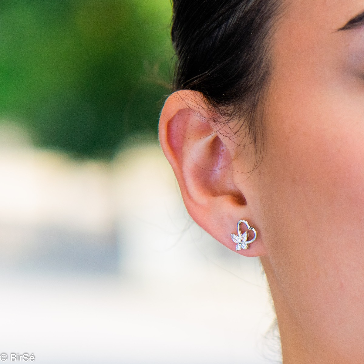 Delicate women's earrings in finely rhodium-plated sterling silver, expertly crafted into a pair of lovely hearts, perched atop dazzling cubic zirconia butterflies. The earrings are fastened with a pin - extremely comfortable and practical. A suitable gif