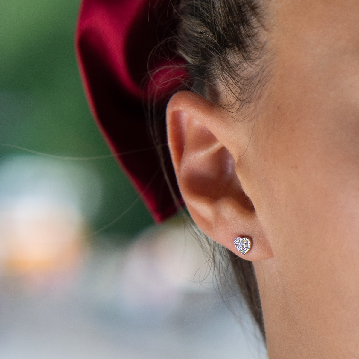 Charming women's heart earrings, masterfully crafted from fine rhodium silver with an elegant design. The elements are beautifully sculpted, dazzling zircons sparkle charmingly, and the pin fastening is comfortable and practical.