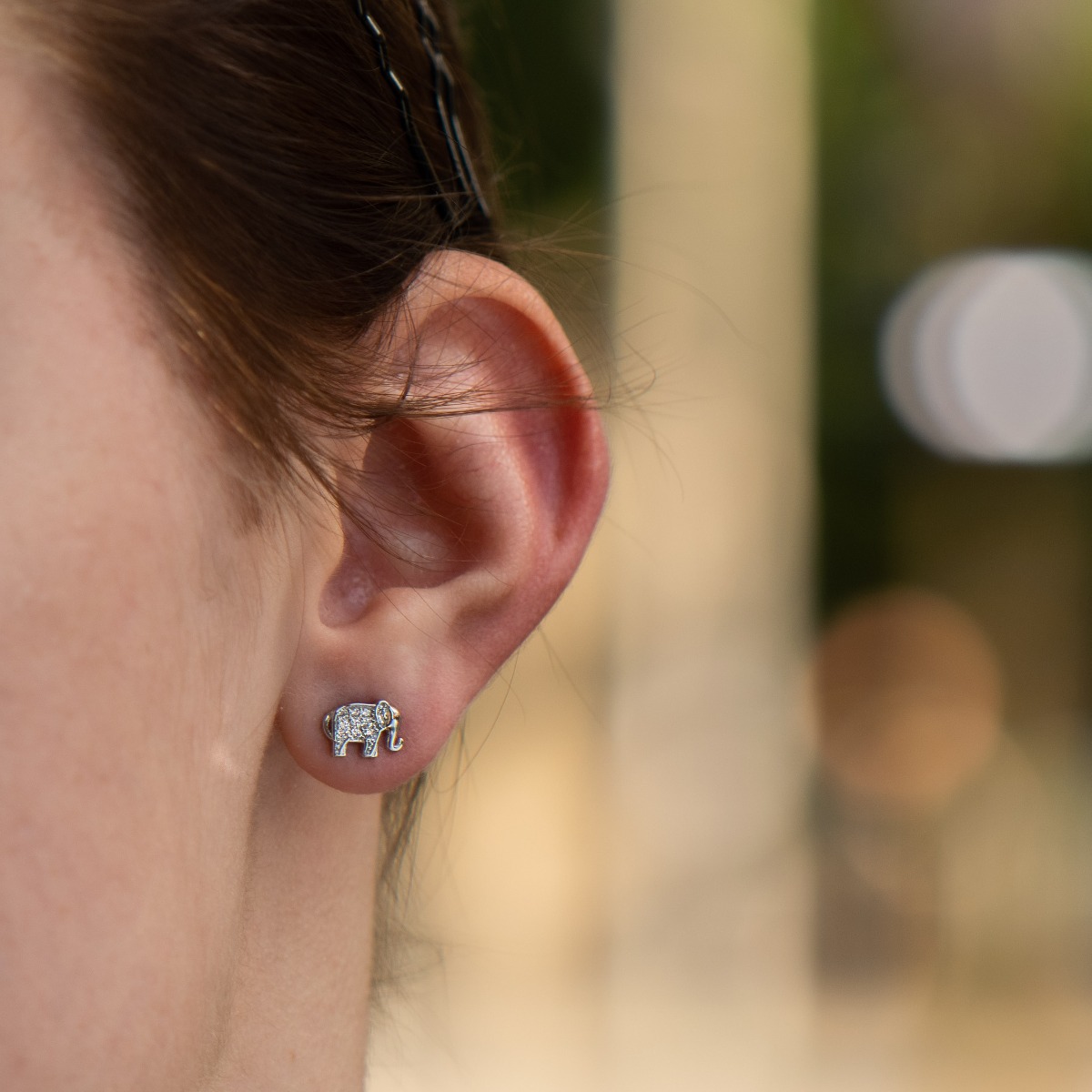 Captivatingly crafted delicate stud earrings with a charming design, all rhodium-plated silver studded with dazzling cubic zirconias.