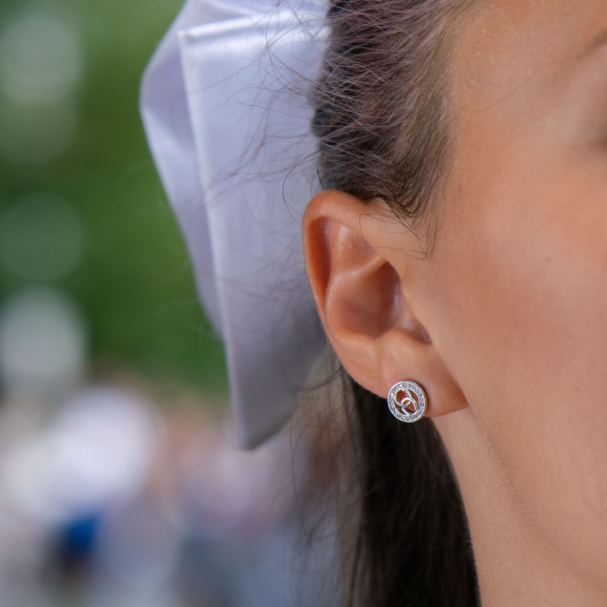 Charming women's stud earrings with a round shape and a stylish design, encrusted with sparkling fine cubic zirconias and made entirely of rhodium silver. Earrings are a suitable gift for any occasion for the beloved woman.