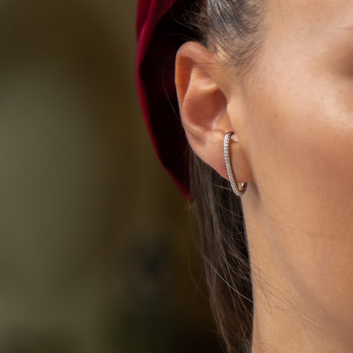 Non-standard earrings in fine rhodium silver with a modern design, decorated with sparkling zircons. Fastening with a pin - practical and comfortable.