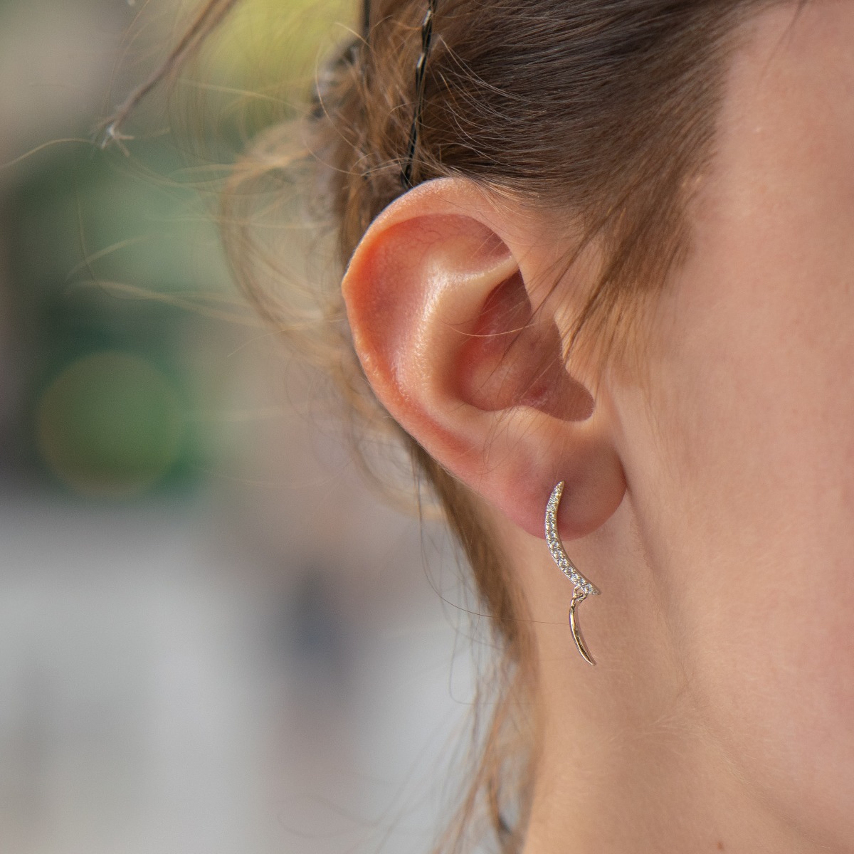 Elegant dangling earrings in fine rhodium silver, with elements decorated with sparkling zircons. Pin fastening - fast, comfortable and preferred by the ladies.