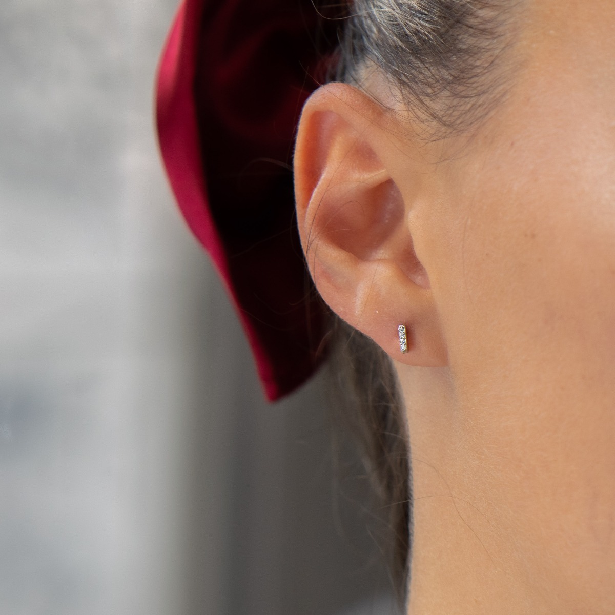 Simple earrings made with an elegant design of the elements of rhodium silver and sparkling zircons. The fastening is with a pin - secure and preferred by the ladies.