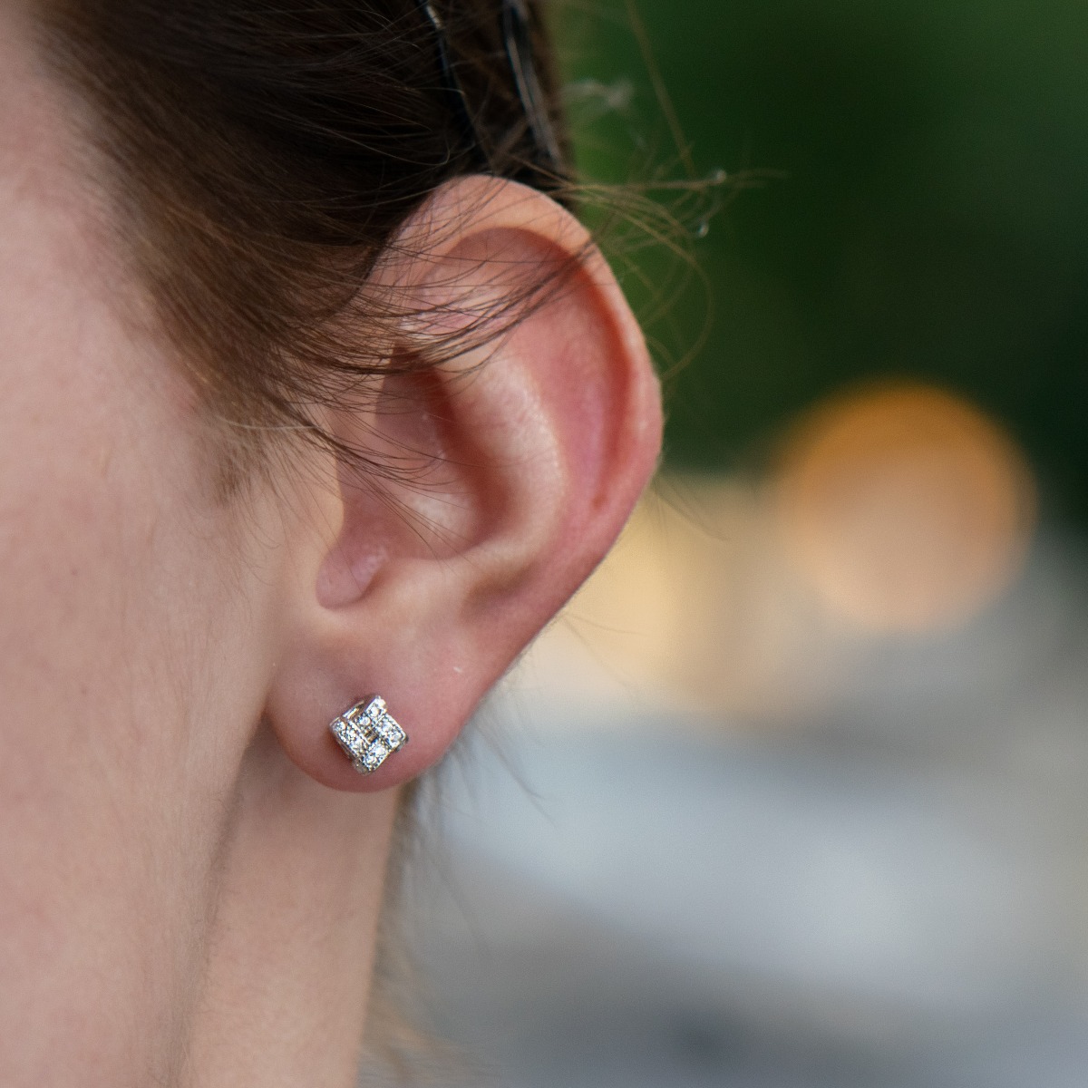 Stylish women's earrings with a modern design, made entirely of soft rhodium silver and shiny zircons, with a pin fastening that is convenient for your everyday life. A suitable gift for stylish ladies.