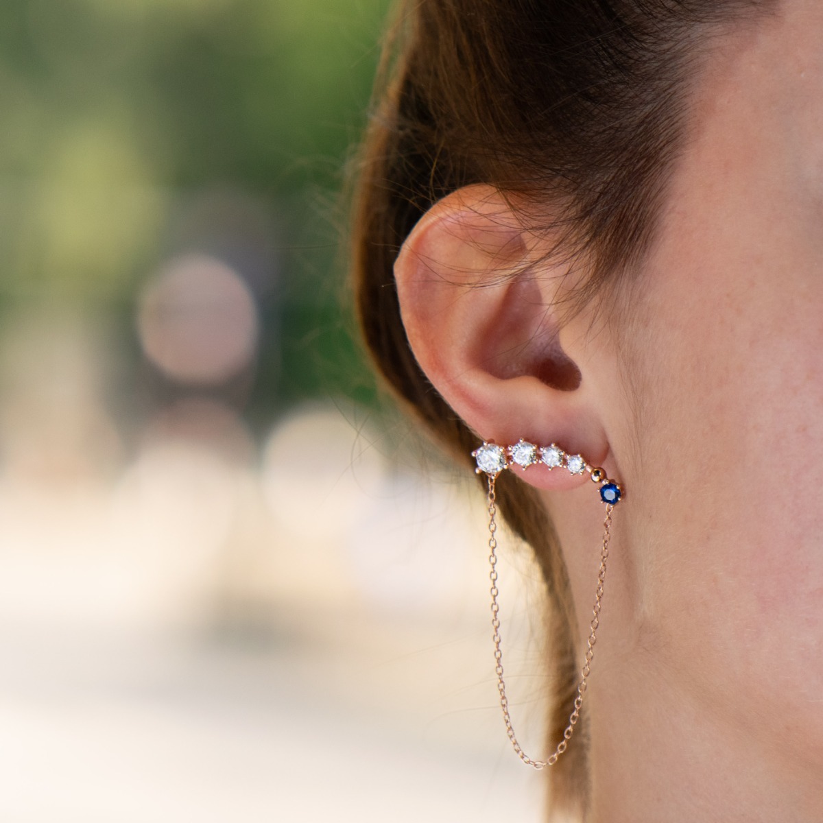 Extremely elegant women's dangling earrings in an exotic style, made entirely of rose silver and multi-colored zircons. The fastening is with a pin for greater convenience, and with these earrings you will feel perfect.