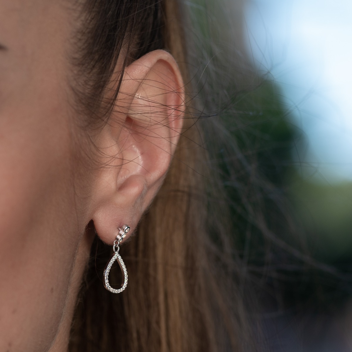 A drop of mood - amazing silver earrings with a spectacular look and a pin fastening. Stylish designer craftsmanship of the compositional elements from a fine combination of rhodium silver with delicate sparkling zircons.