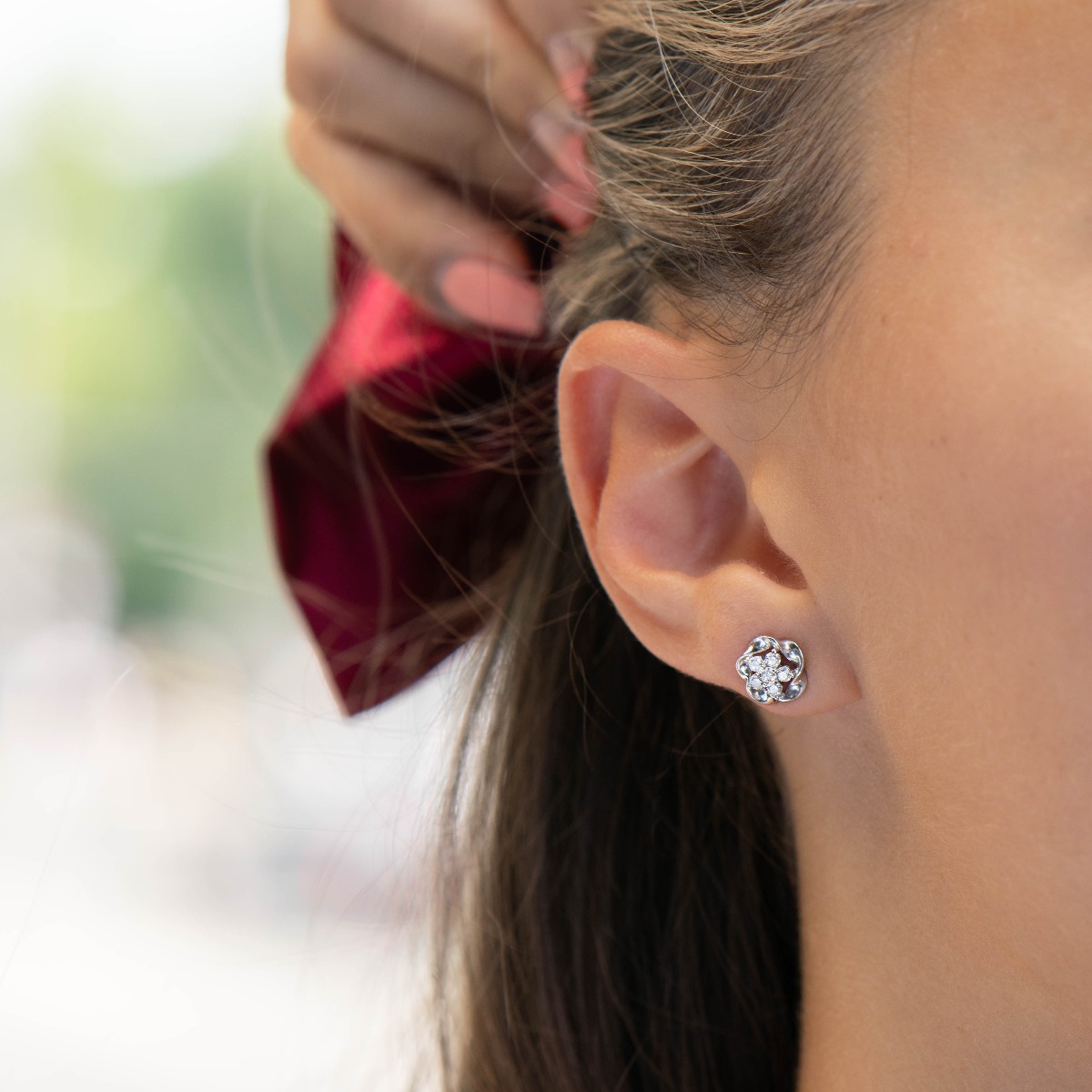 Captivatingly exquisite earrings with a charming design in rhodium silver, elegantly decorated with zircons. Pin fastening for convenience and security. They are beautifully combined with jewelry made of silver and zircons.