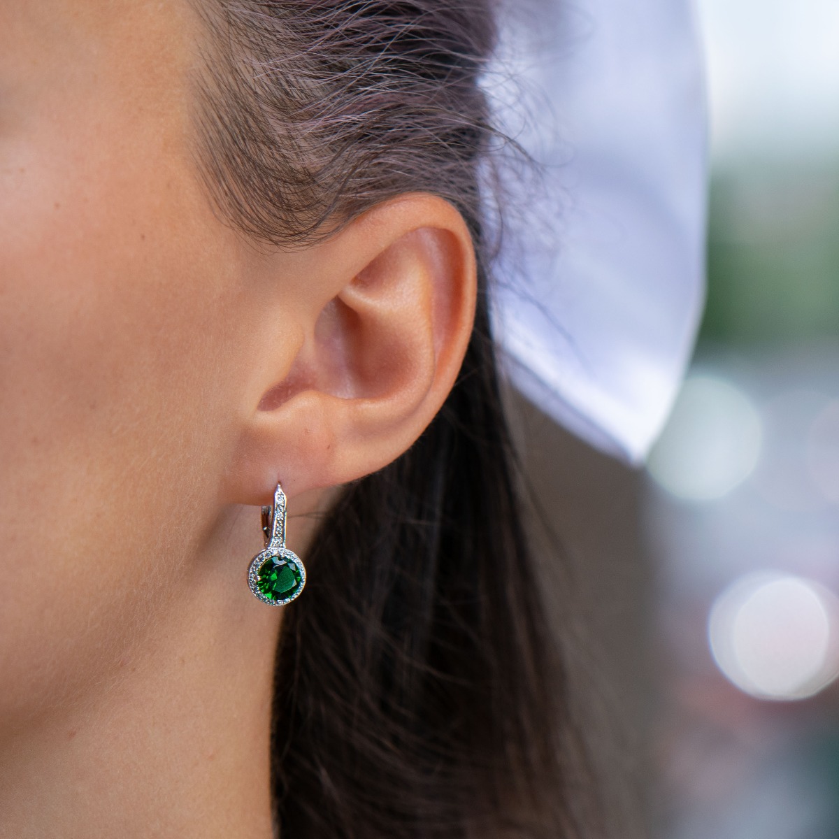 Extremely fine sterling silver earrings with a willow clasp and precise, slightly dangling craftsmanship, combining rhodium-plated silver with sparkling zircons and tourmaline.