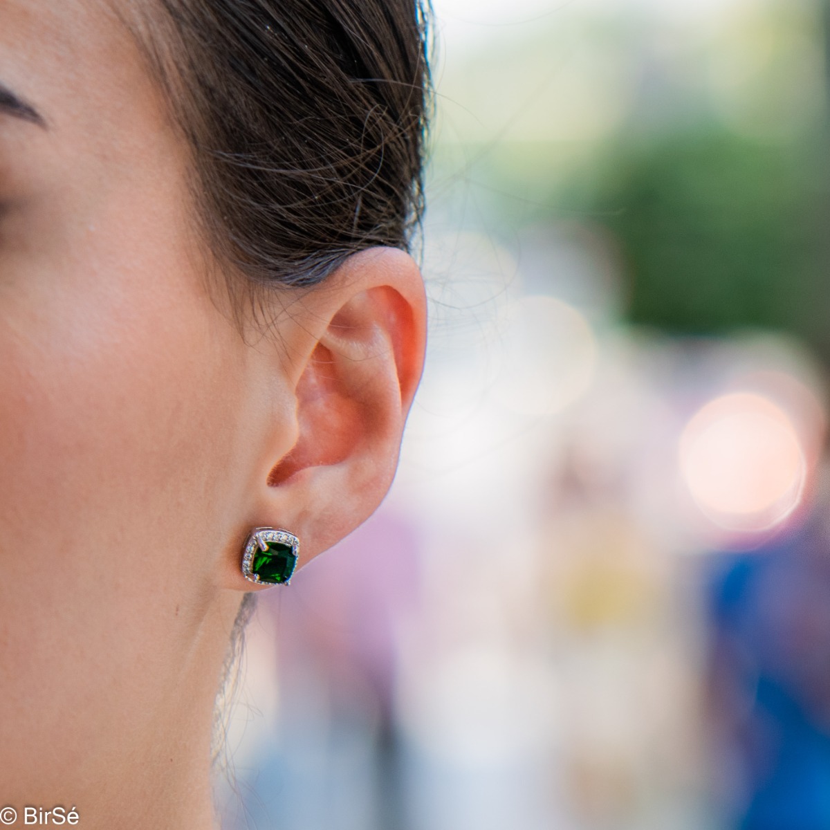 Sophisticated silver earrings with a classic shape and an enchanting tourmaline stone. Stylish composition made of a fine combination of rhodium-plated silver with sparkling zircon stones. They are suitable for combining in a set with a silver pendant and