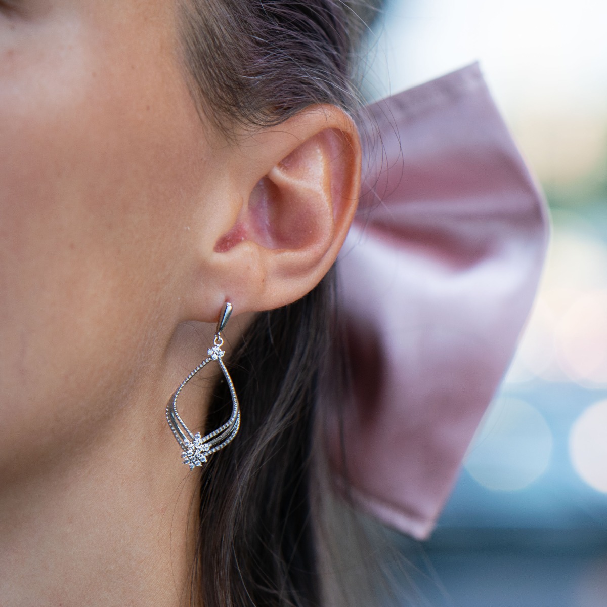 Silver earrings "Magic" - an extremely beautiful piece of jewelry. Made entirely of rhodium-plated silver, with fine elements and added zircons for even more opulence. Pin fastening is convenient and secure for ladies.