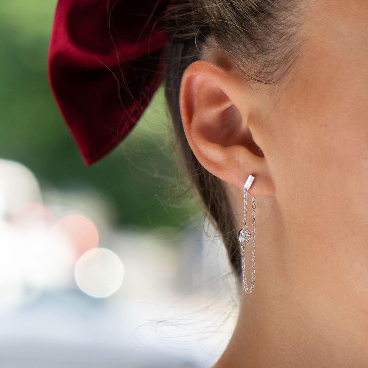 A stylish model of women's dangling earrings with an elegant design, completely formed by combining rhodium-plated silver with sparkling zircons. The fastening is with a pin - comfortable and practical. A wonderful mood for your everyday life with BirSe e