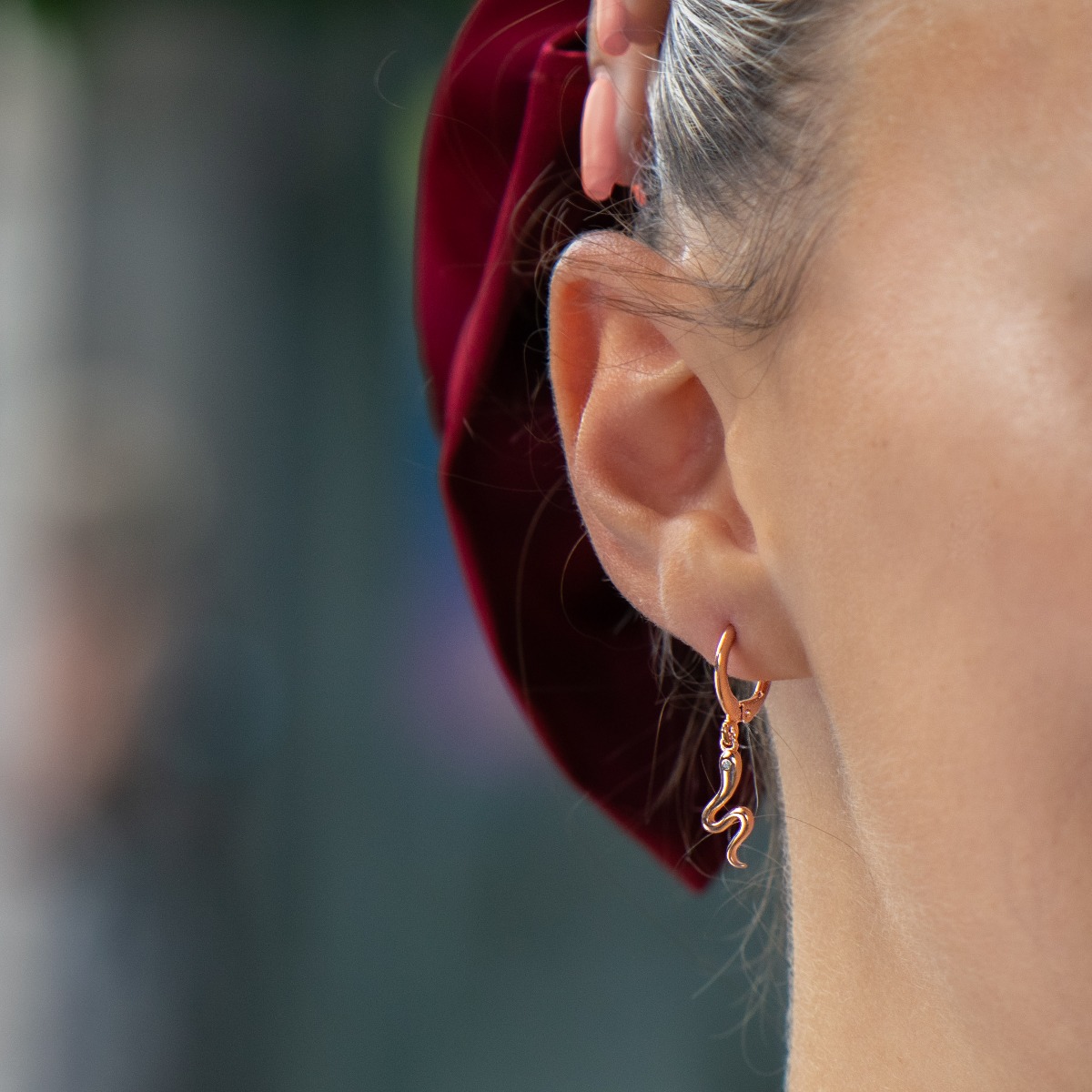 Delicate, airy and light earrings made with a playful design of fine rose silver small snakes. Suitable for ladies with a sense of humor.