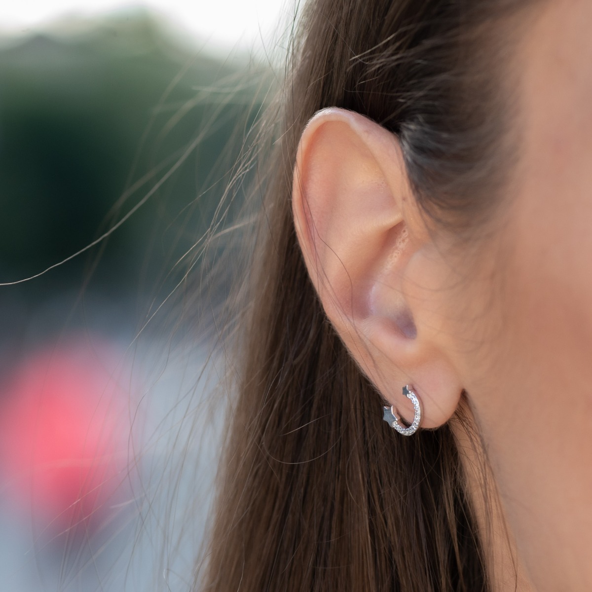 Extremely impressive silver earrings with a rainbow shape, fine stars and pin fastening. Stylish composition made of a fine combination of rhodium-plated silver with sparkling zircon stones.