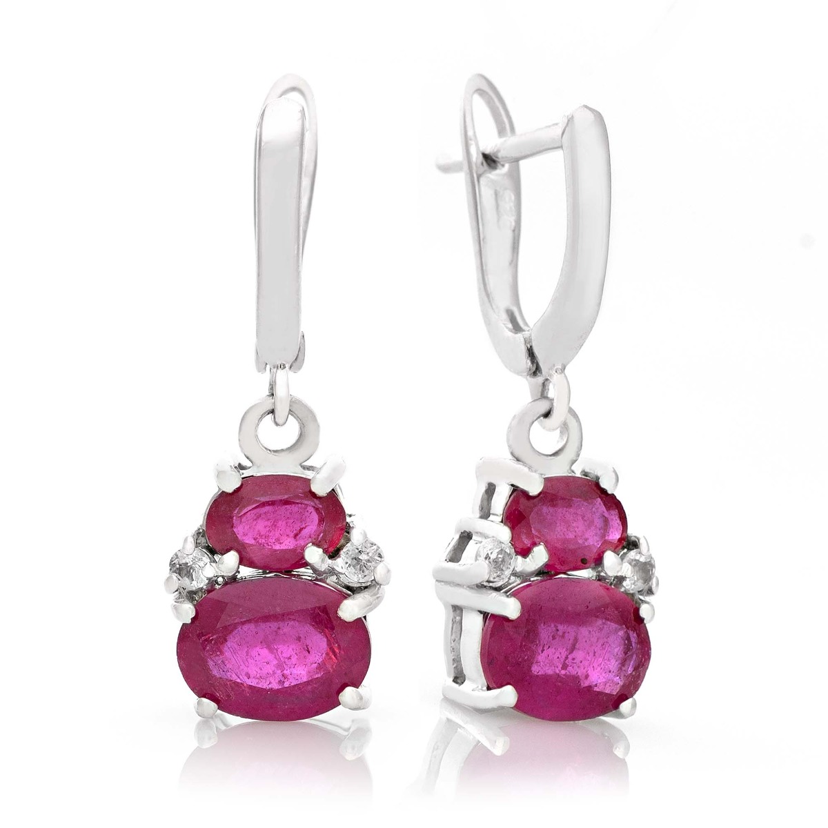 Elegantly crafted ladies' earrings in rhodium silver with a dangling pattern and a comfortable English clasp. The exquisite rubies in combination with sparkling zircons turn the earrings into a charming piece of jewelry, which together with a ring and a p