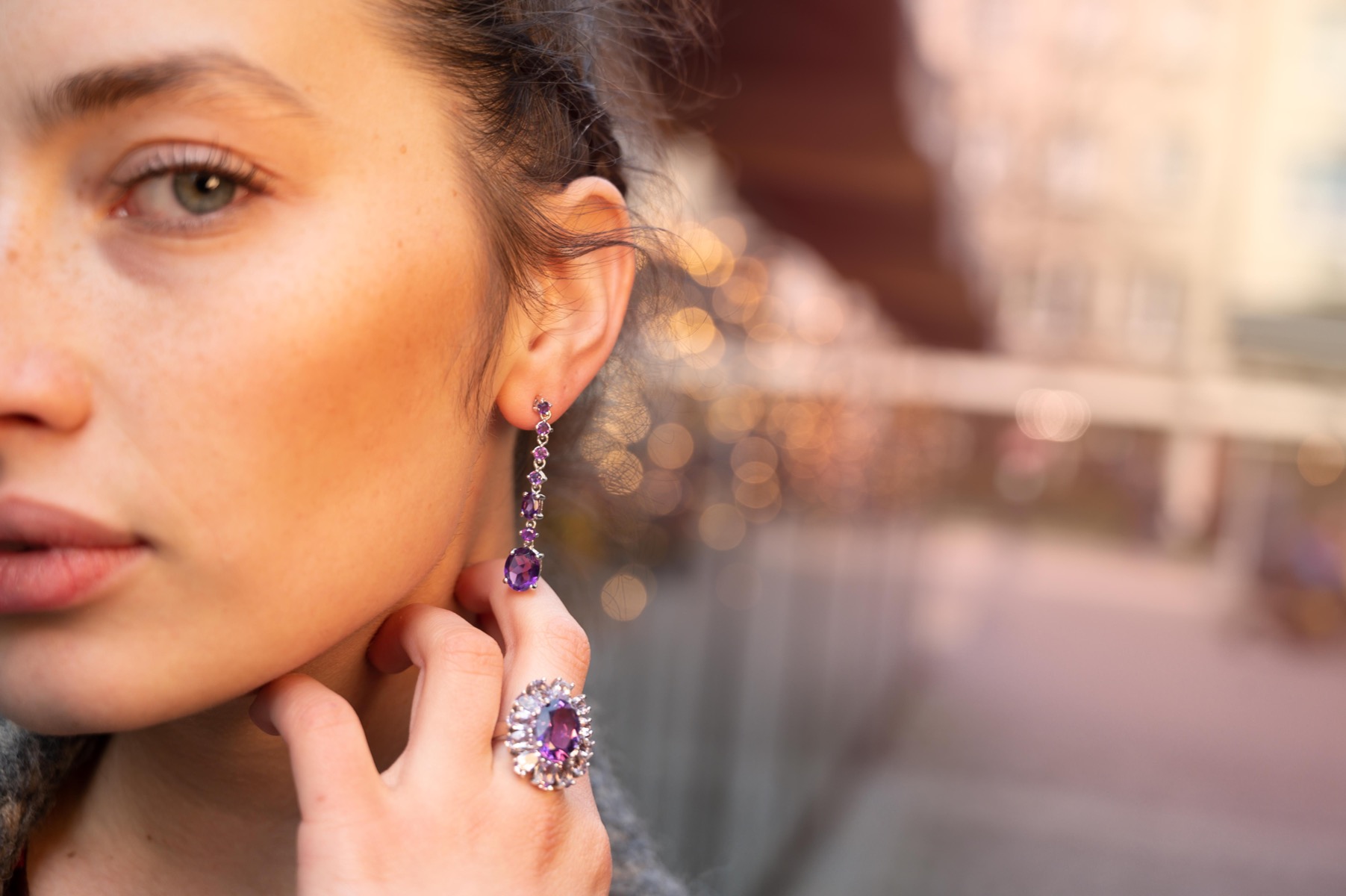 Radiant and spectacular dangling stud earrings with multi-faceted and variously shaped natural amethyst stones and delicately crafted from fine rhodium silver.