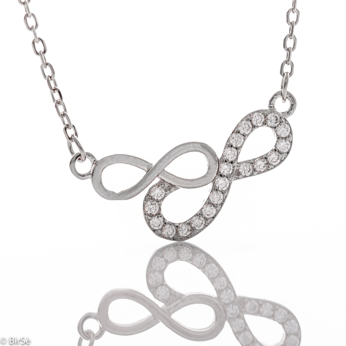 An elegant women's necklace in the shape of gentle infinities, studded with glittering zircons and made entirely of spectacular rhodium-plated silver.