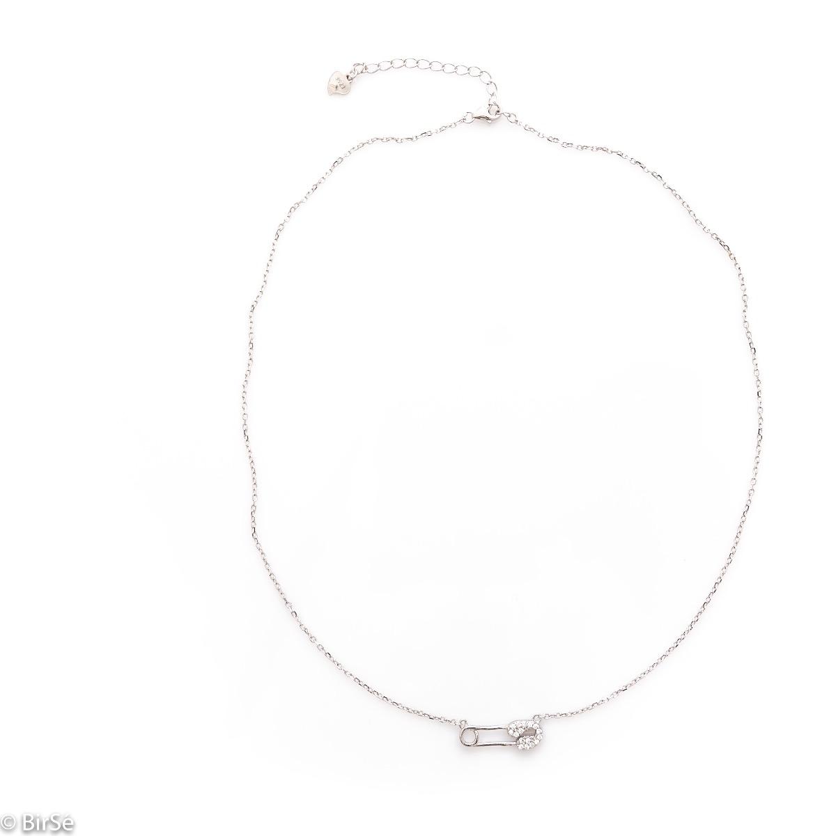 A spectacular necklace with an exquisite shape of a delicate safety pin, complemented by fine, sparkling zircons and made entirely of rhodium-plated silver.