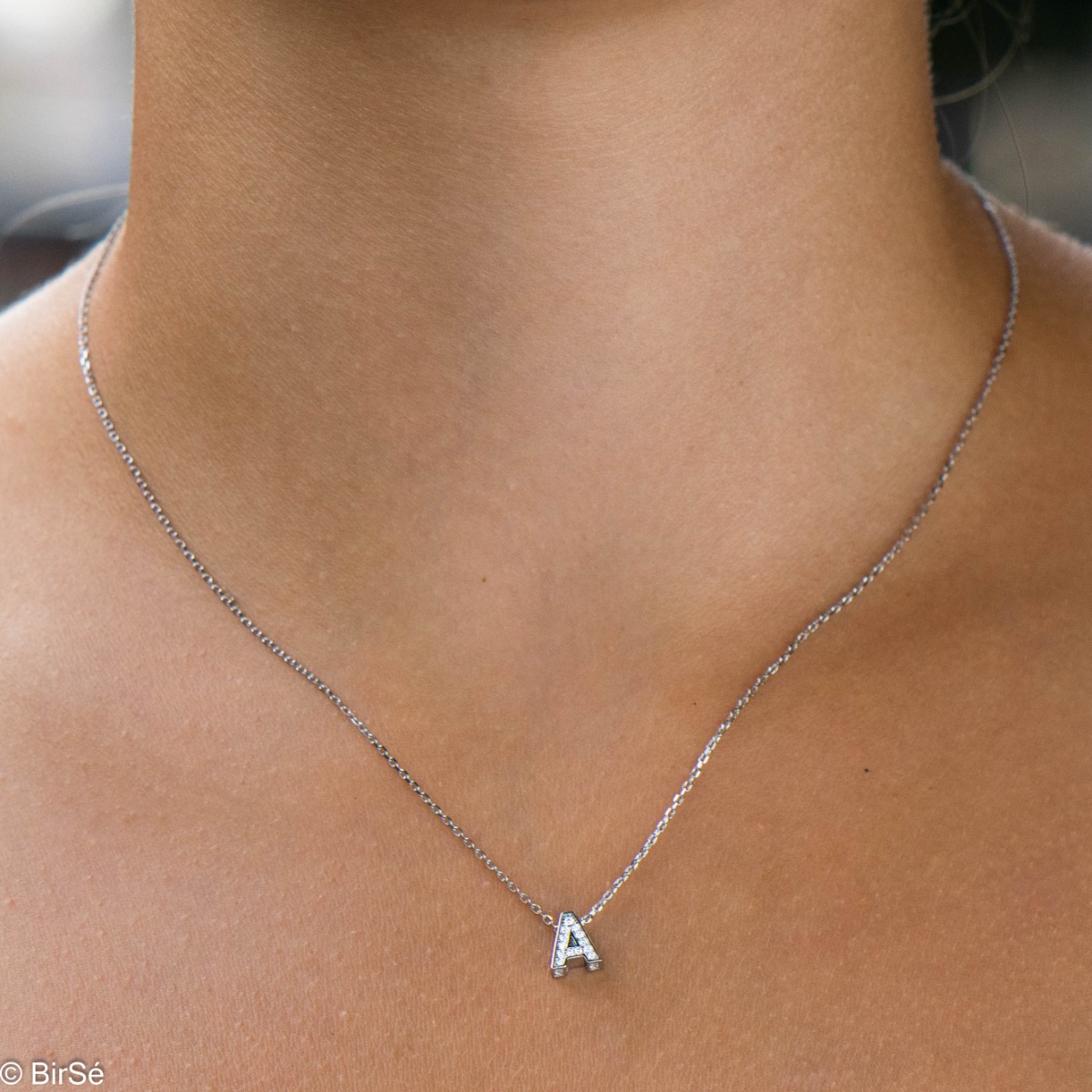 Finely crafted women's rhodium silver letter A necklace, all covered with glittering zircons. An attractive piece of jewelry in which the delicate beauty of rhodium-plated silver is skilfully combined with the brilliance of zircons.