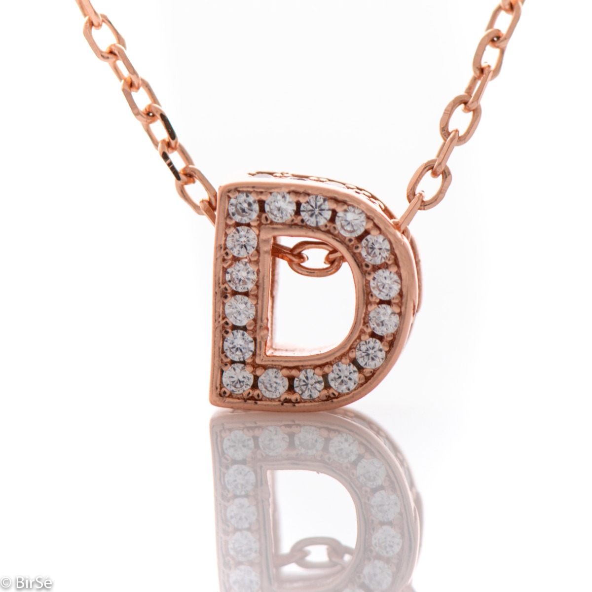 Finely crafted rose silver letter D necklace for women, all encrusted with glittering zircons. An attractive piece of jewelry in which the delicate beauty of rose silver is skilfully combined with the brilliance of zircons.