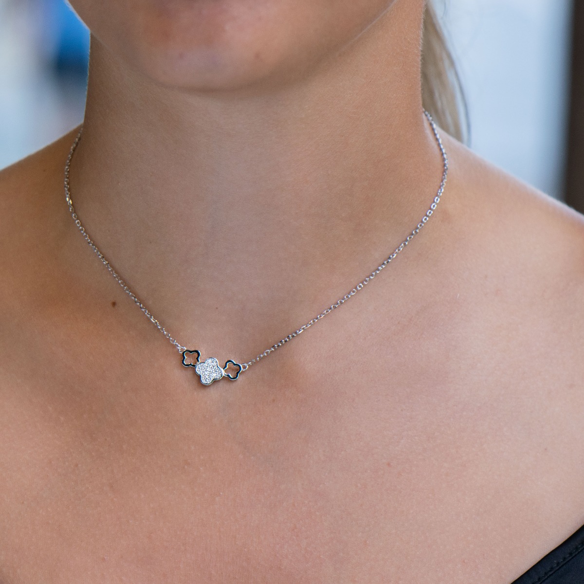 A rhodium-plated sterling silver necklace in the shape of a clover, beautifully studded with zircons. Suitable for ladies of any age.