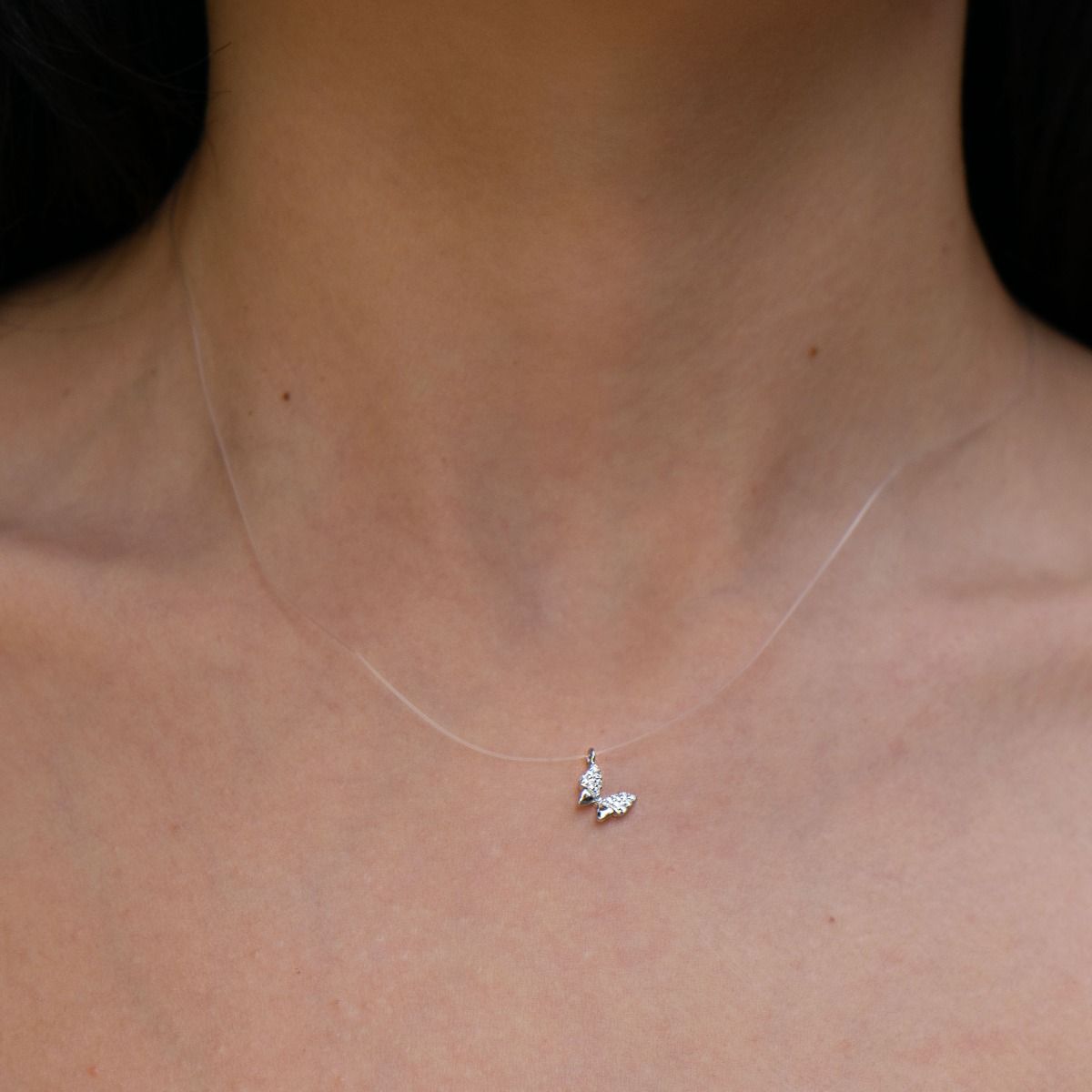 A charming necklace model, an offer from the new BirSe collection. The butterfly pendant is crafted from rhodium-plated silver, with delicate wings made of sparkling zircons. The chain has been replaced with a fine cord.