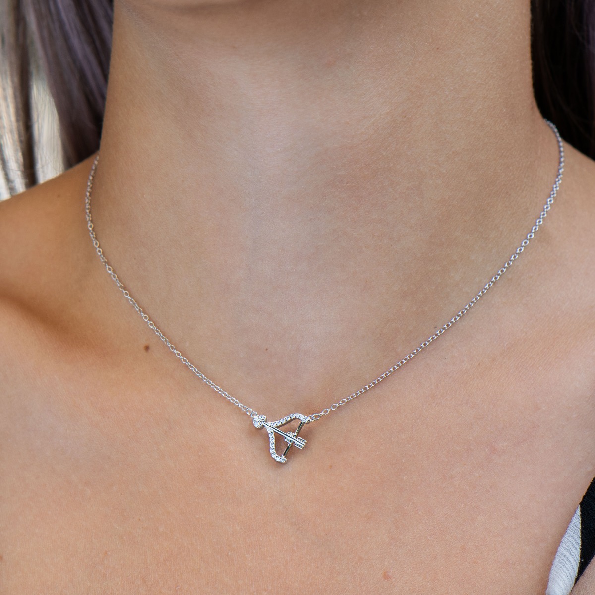 Cupid's bow silver necklace - a lovely piece of jewelry from the BirSe collection for your favorite girl. It is made entirely of rhodium-plated silver and fine zircons. A suitable gift to show your feelings.