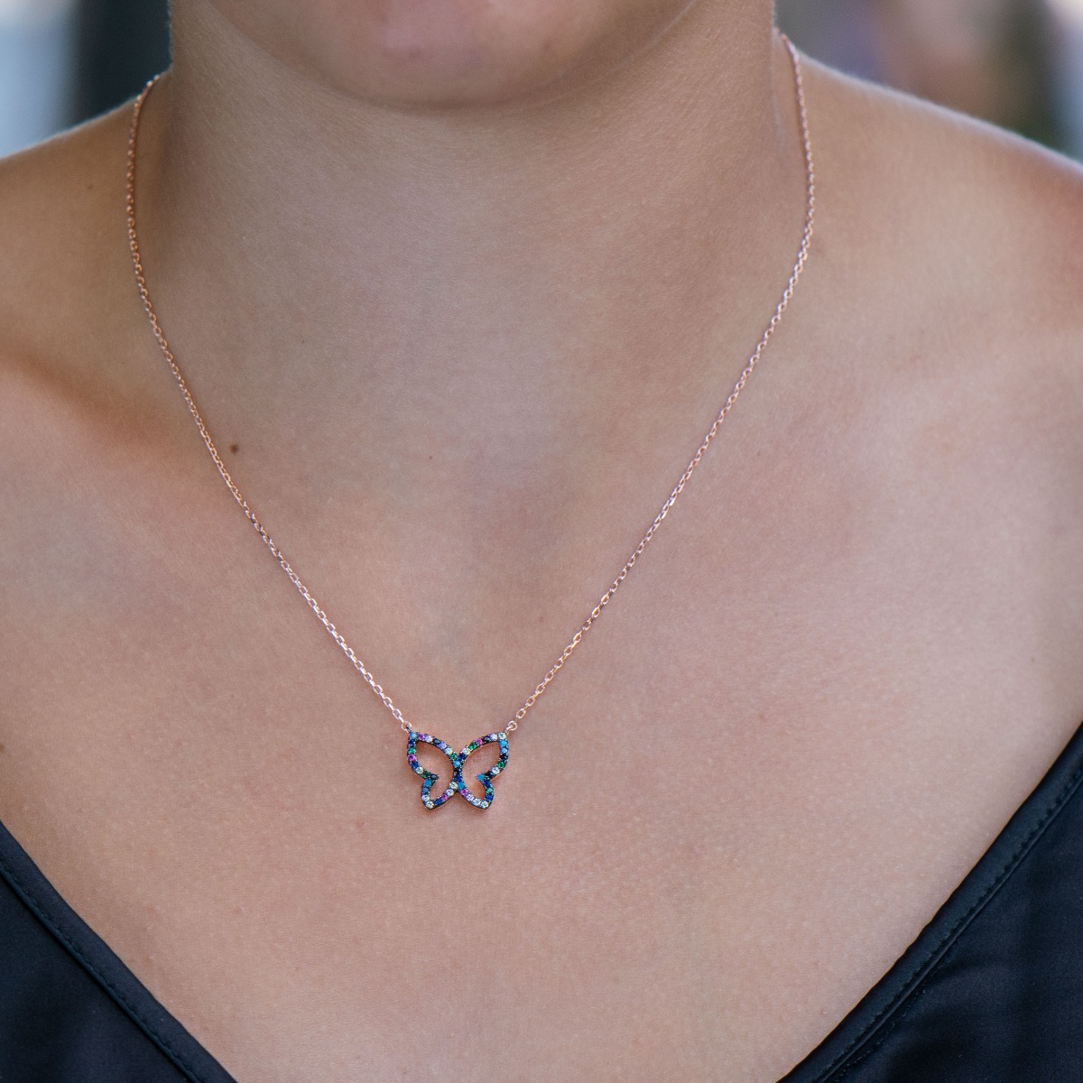 A beautiful multi-colored butterfly represents the necklace made of soft pink silver, with sparkling multi-colored zircons, which gathers all the charm of a summer day.