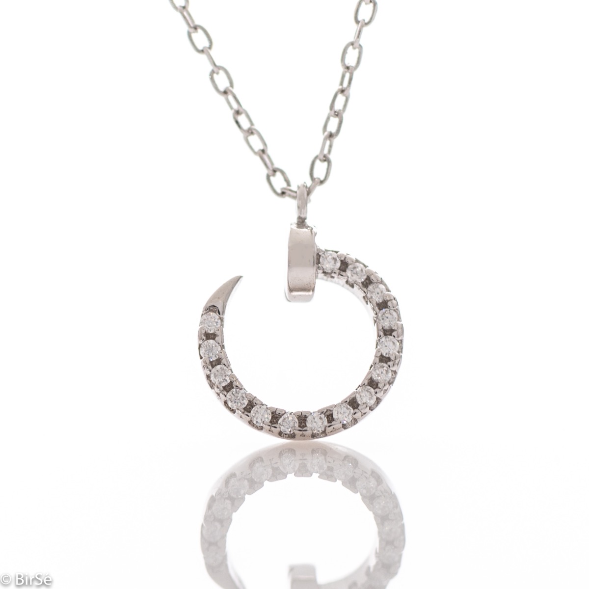 An exquisite silver necklace with a spectacular element of a small nail complemented by shiny zircons and made entirely of soft rhodium-plated silver.