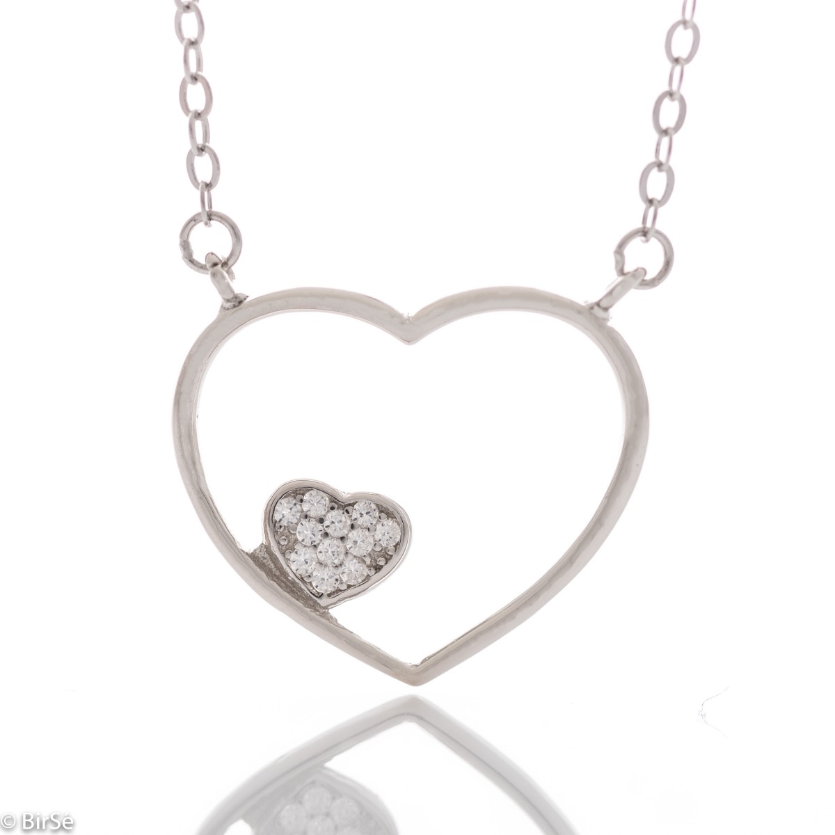 A delicate silver necklace with a delicate heart, complemented by a smaller heart of sparkling zircons. Beautiful design and precision craftsmanship entirely in rhodium-plated silver.