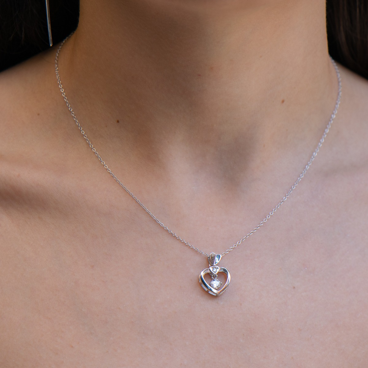 Delightfully gentle necklace of glittering rhodium silver with a uniquely beautiful zircon, beautifully executed in details and evoking romantic emotions. A necklace suitable as a gift for a loved one - daughter, wife, girlfriend or mother.