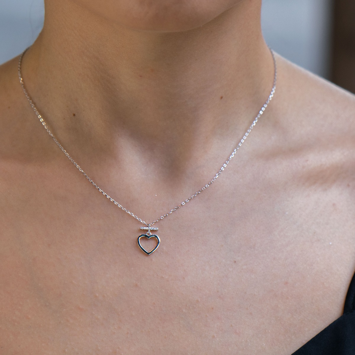 Elegant women's necklace made of silver and zircons. Stylish elegance and symbolism in the shape of a heart - the embodiment of love and passion.