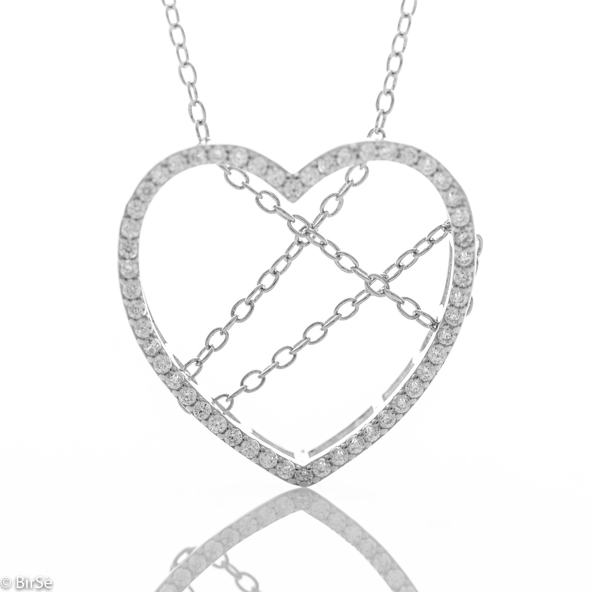 Spectacular silver necklace with exquisite workmanship entirely of rhodium-plated silver and a large heart, complemented by glittering zircons and a spectacular tangled chain.