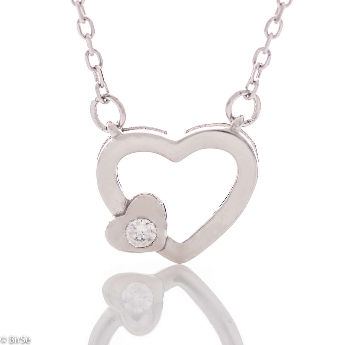 A delicate silver necklace with a heart and a sparkling zircon, made entirely of refined rhodium-plated silver.