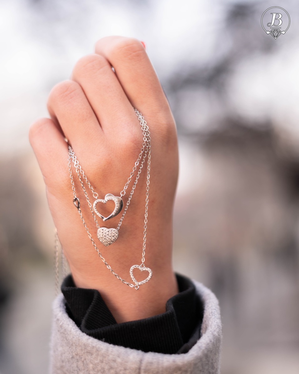 A stylish and delicate ladies' necklace with a fine rhodium-plated silver design and a small heart shape, studded with sparkling zircons. Suitable for everyday life.