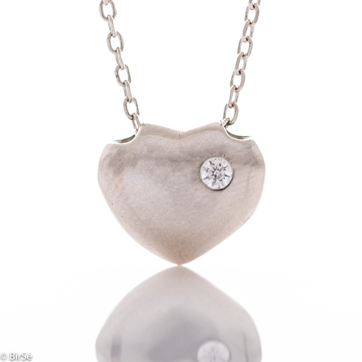 A fine women's necklace suitable for everyday life, with delicate workmanship entirely of rhodium-plated silver and a small heart complemented by a shiny zircon.