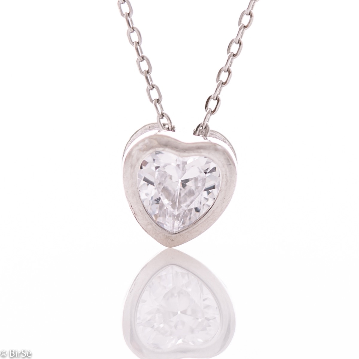 Symbolic women's necklace with a light weight and delicate workmanship combining rhodium-plated silver with an extremely fine heart of shiny zircon.