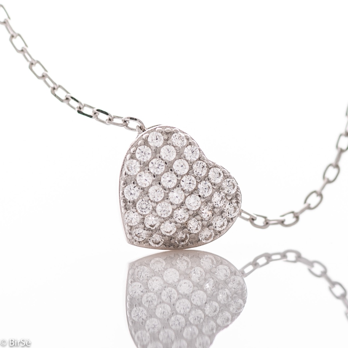 A stylish and delicate ladies' necklace with a fine rhodium-plated silver design and a small heart shape, studded with sparkling zircons. Suitable for everyday life.