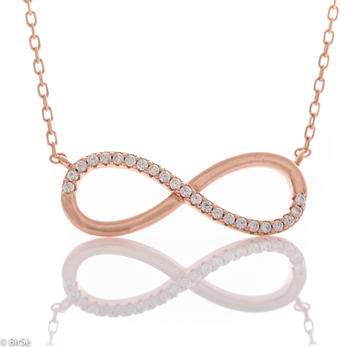 An exquisite women's necklace in the shape of a gentle infinity, complemented by sparkling zircons and made entirely of spectacular rhodium-plated rose silver.