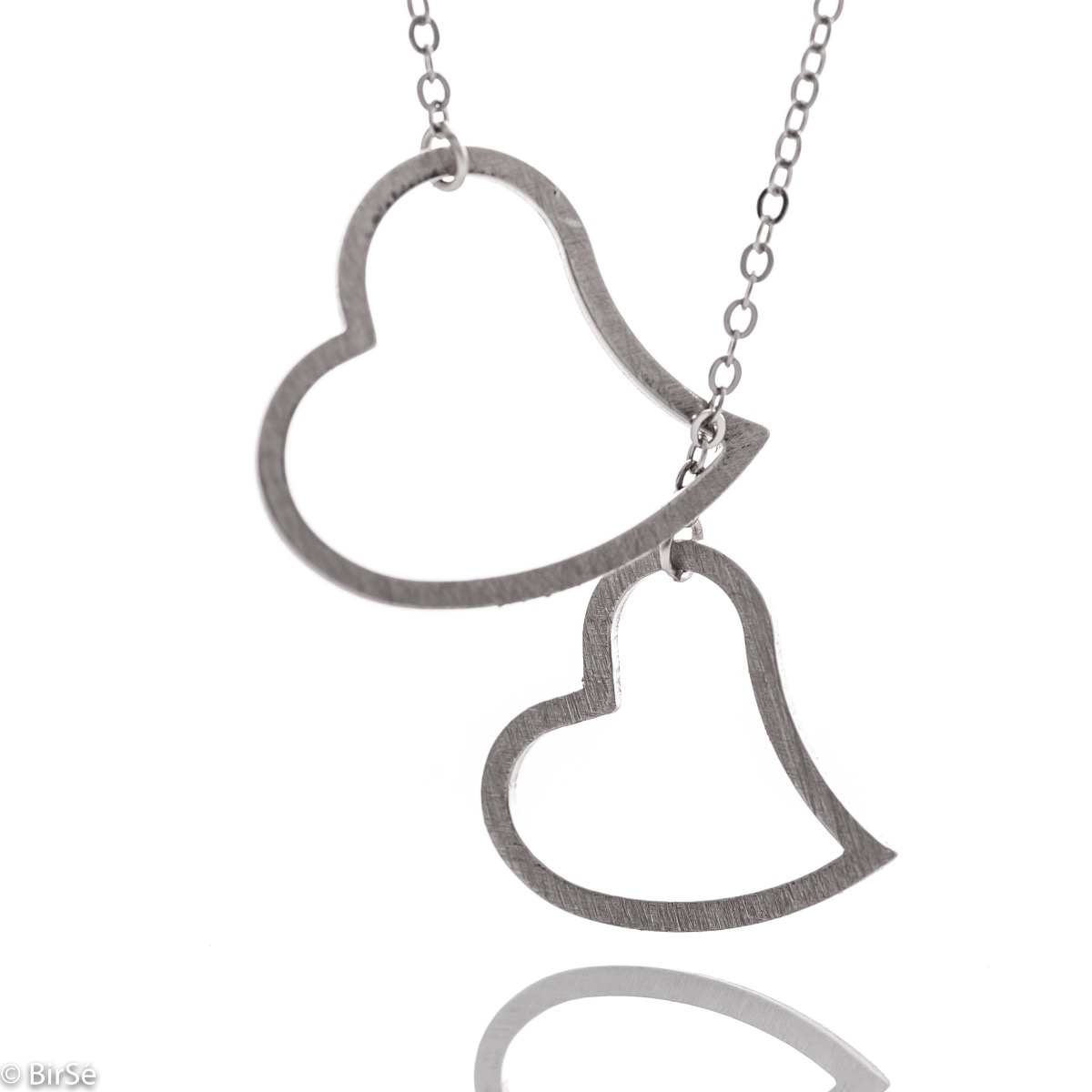 Spectacular and beautiful women's necklace combining two delicate hearts and made entirely of shiny rhodium-plated silver.