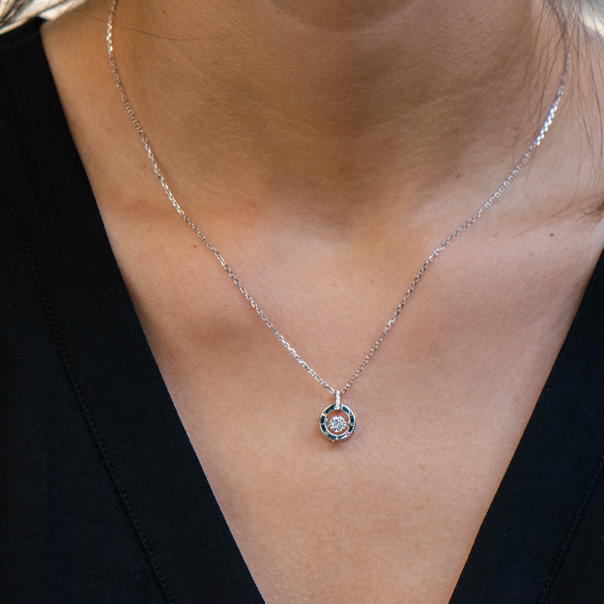 A delicate women's necklace with fine workmanship entirely of rhodium-plated silver, combined with sparkling zircons and exquisite details.