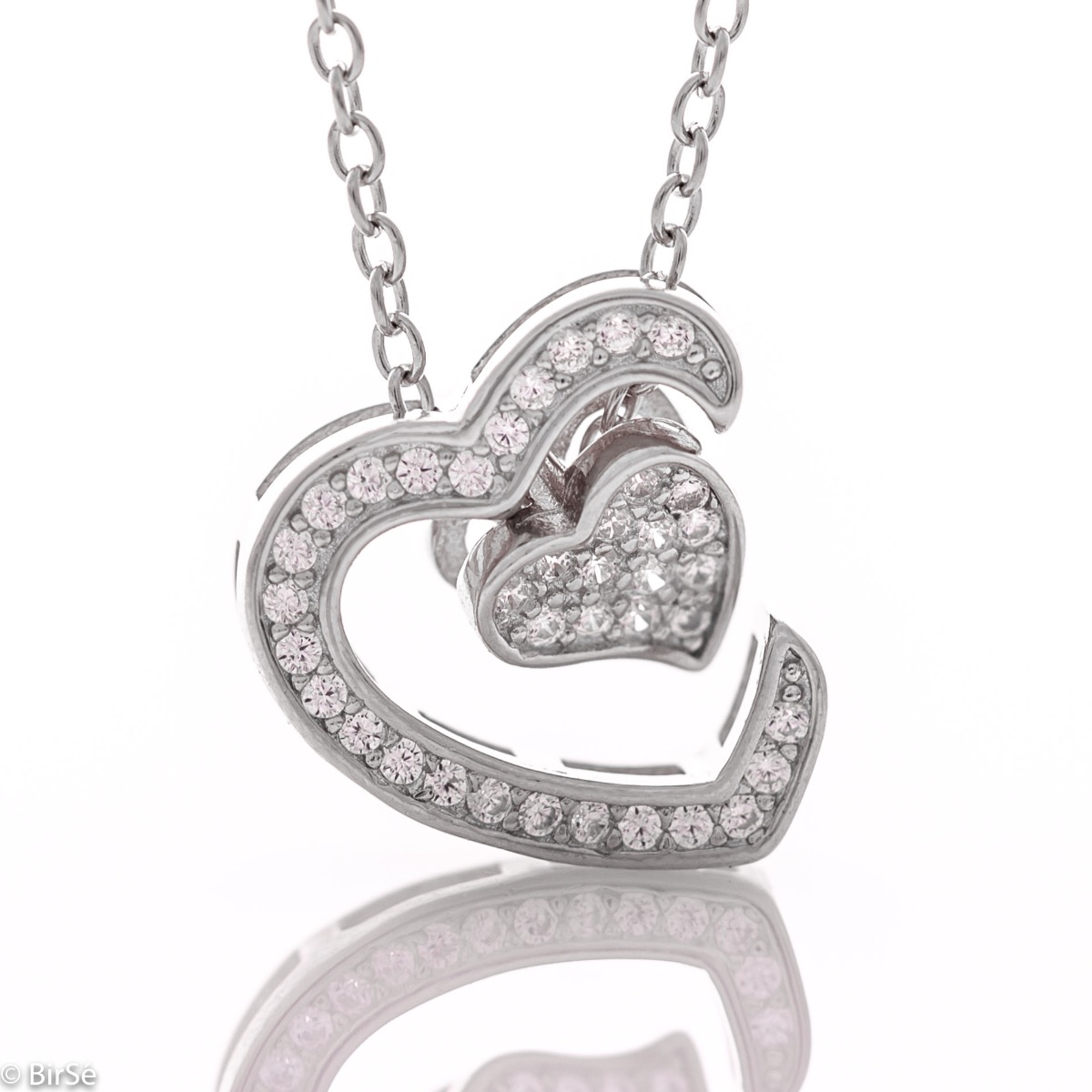 An exquisite women's necklace with precise craftsmanship combining delicate rhodium silver with glittering zircons and the shape of two beautiful hearts.