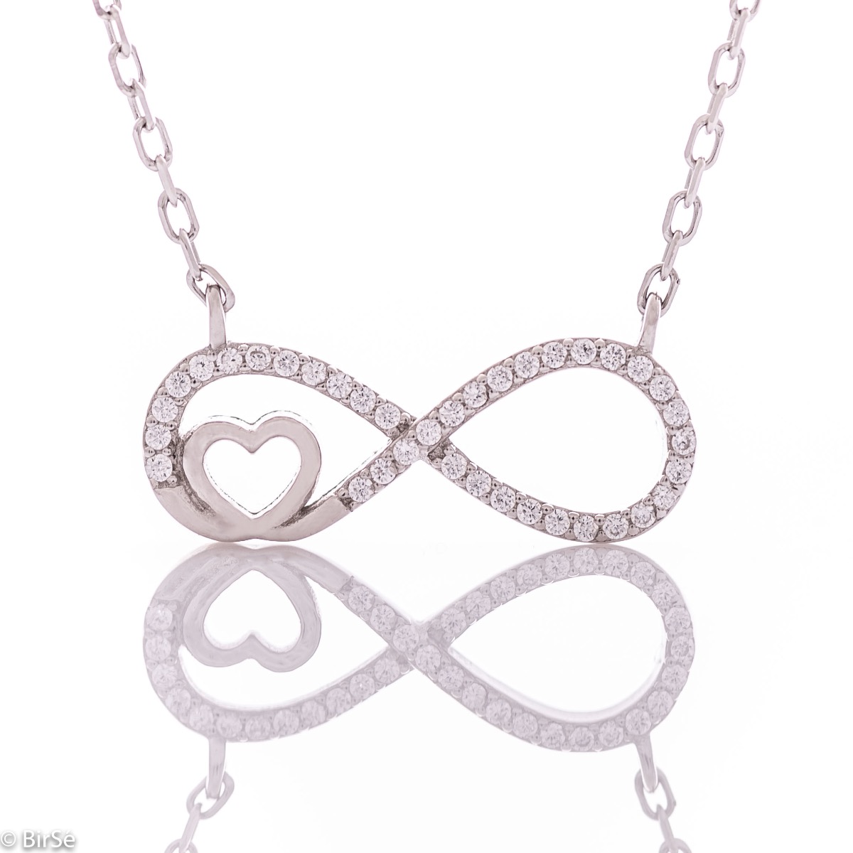 An exquisite women's necklace with precision craftsmanship entirely of rhodium-plated silver, combining a delicate infinity shape, intertwined with a heart and sparkling zircons.