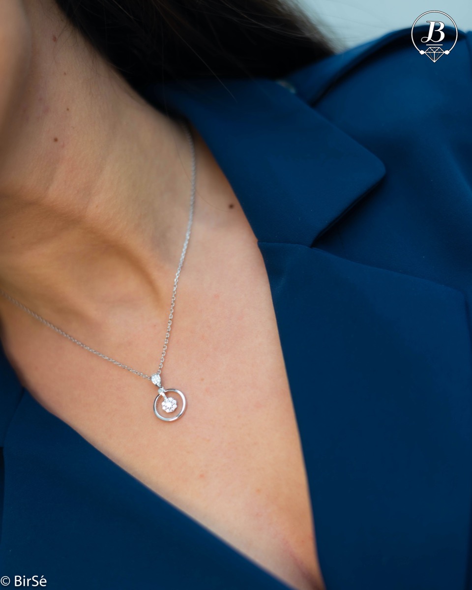 A delicate silver necklace with precise craftsmanship and an exquisite circle shape complemented by fine, sparkling zircons and rhodium-plated silver.