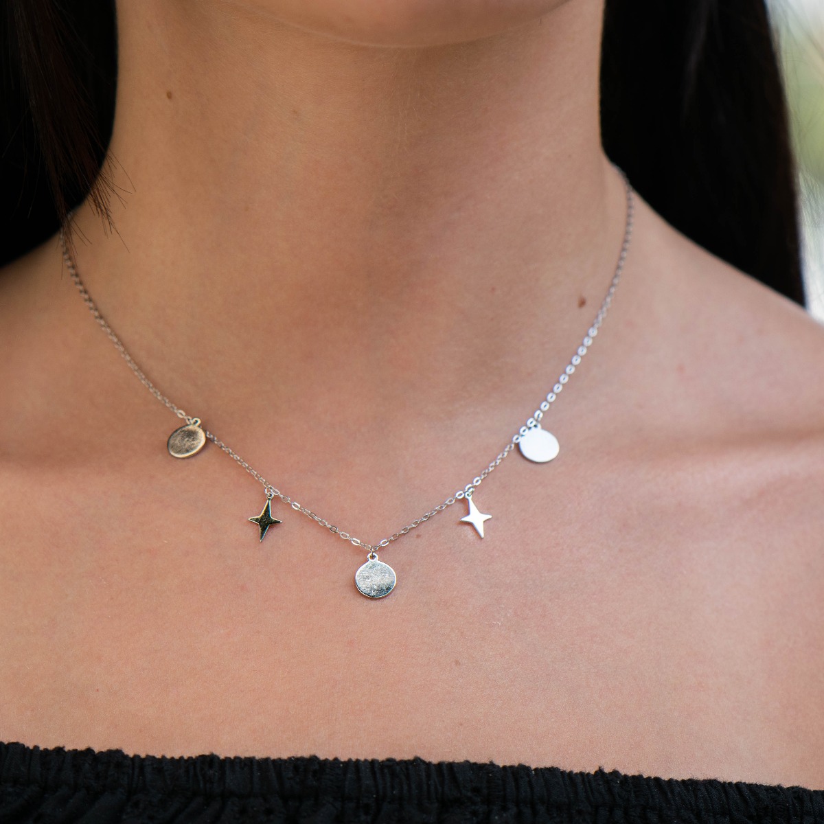 An exceptional silver necklace with precise and spectacular pendants made entirely of rhodium-plated silver.