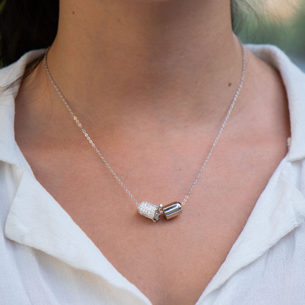 Stylish women's necklace made of fine silver with an interesting design, with countless sparkling zircons added. Send a secret message of love. Delight your girl with the adorable necklace from BirSe.