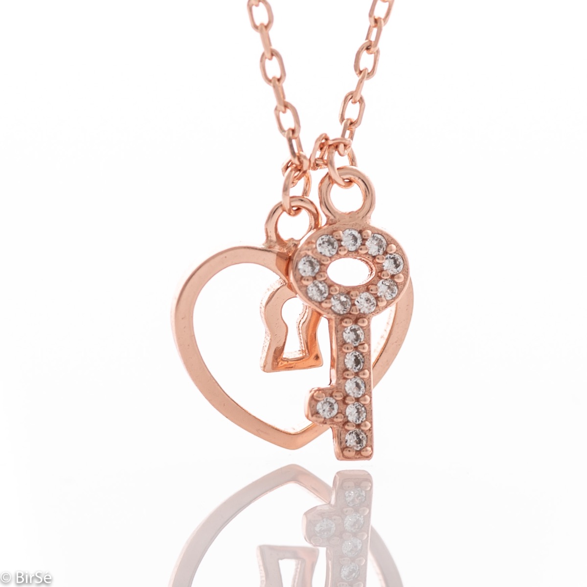 Extremely gentle ladies' necklace with a fine heart-shaped lock, complemented by a little kitty. Precisely crafted entirely from rhodium-plated rose silver, combined with sparkling zircons.